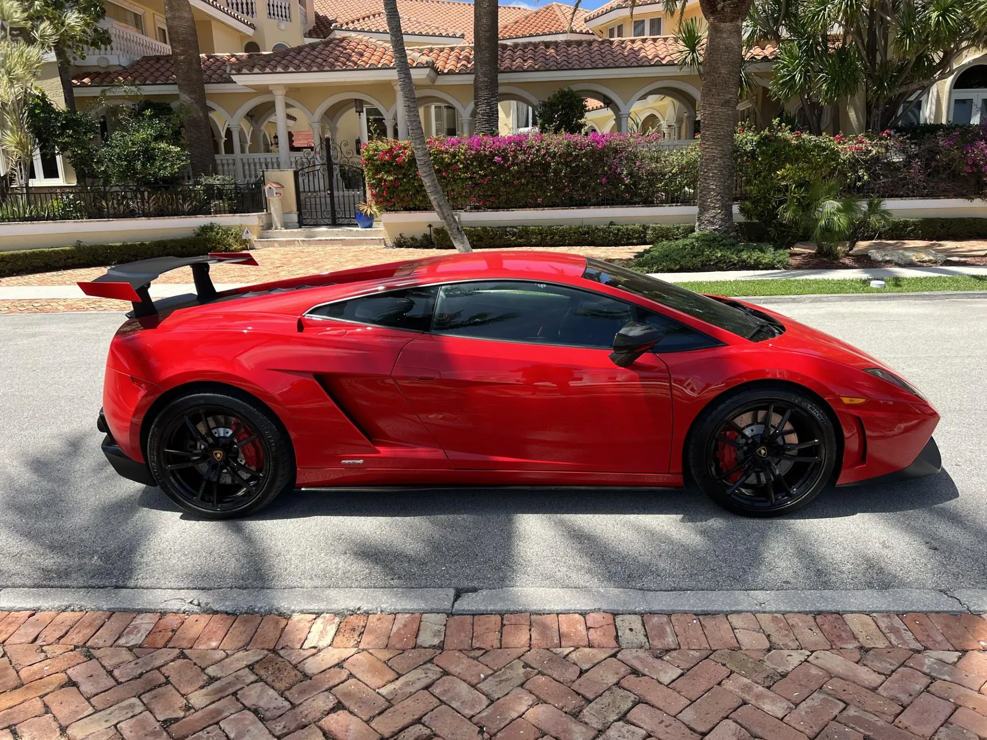 Lateral Lamborghini Gallardo Super Trofeo Stradale 2012 Rojo